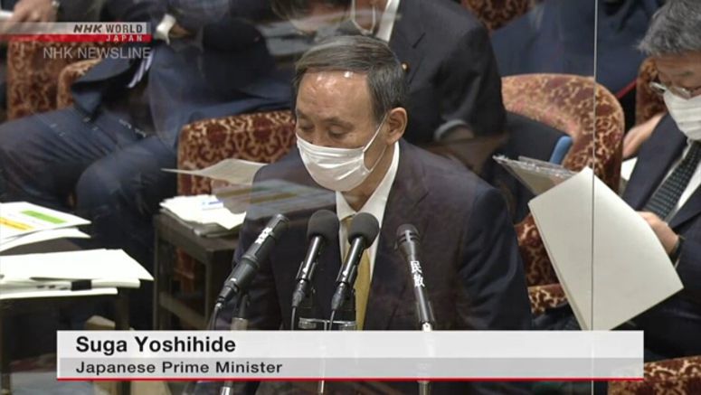 Suga apologizes for strained healthcare system