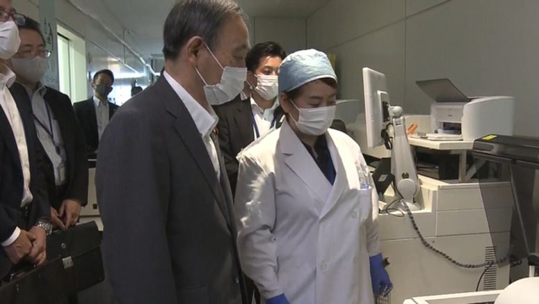 Suga inspects Haneda Airport's quarantine controls