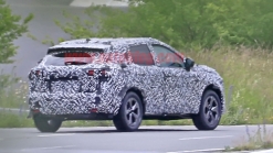 Nissan Rogue Sport spied covered in camo from atop a tree