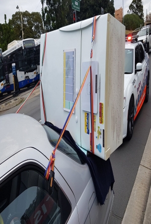 Aussie Tries To Carry Fridge On A Toyota Camry, Police Aren't Impressed