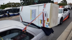 Aussie Tries To Carry Fridge On A Toyota Camry, Police Aren't Impressed
