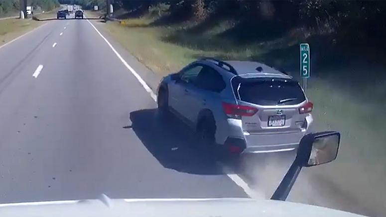 Subaru Driver Attempts To Pass Semi Truck With Two Wheels On The Grass, Barely Makes It Through