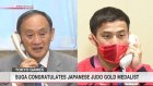 Suga congratulates Japanese judo gold medalist