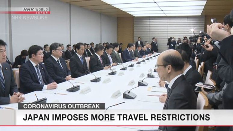 Japan imposes more travel restrictions