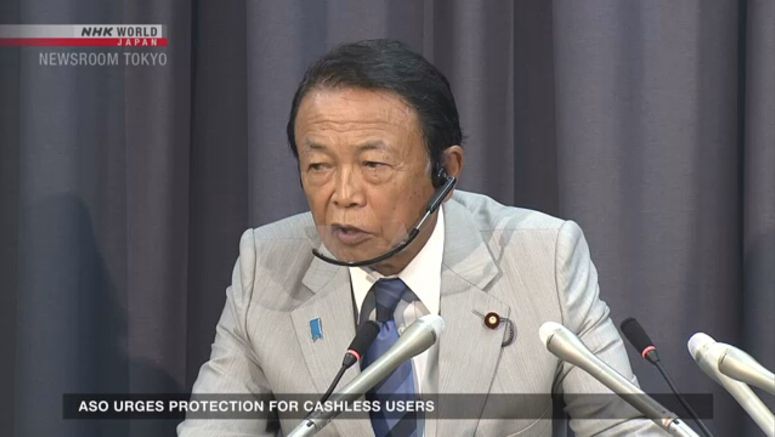 Aso urges scam-hit Docomo to put customers first