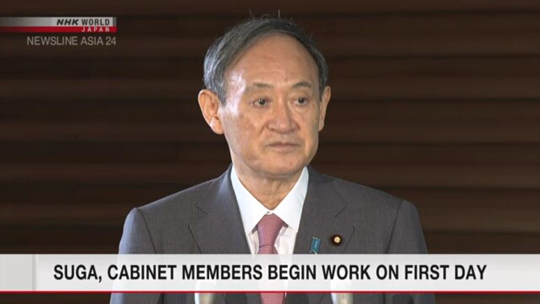 Suga, Cabinet members begin work on first day