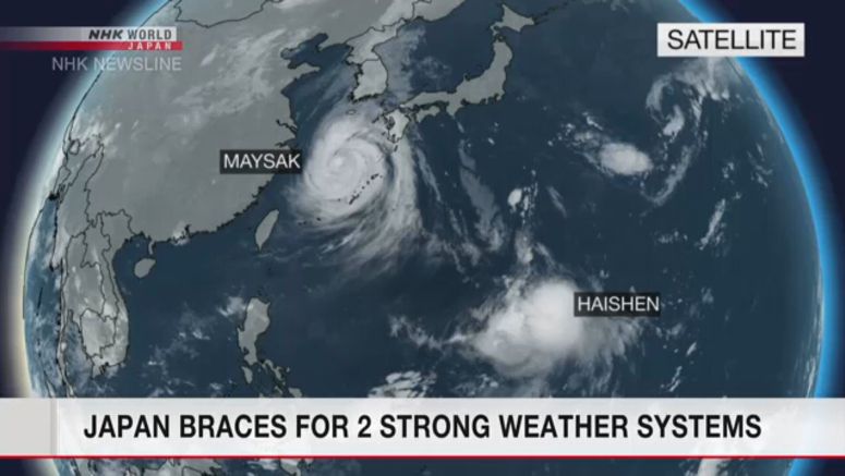 Japan braces for two powerful weather systems