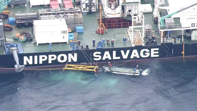Sunken tour boat raised close to sea surface off Hokkaido