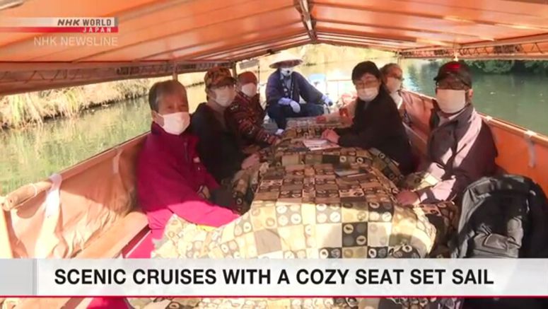Tourists enjoy sightseeing on boats equipped with traditional kotatsu heaters