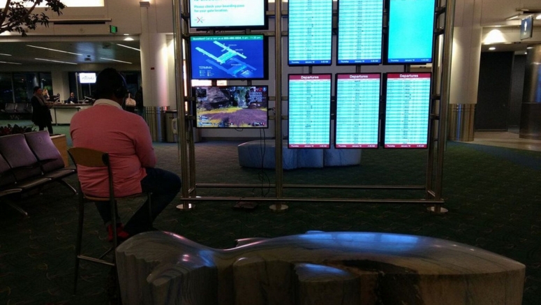 Man Hijacks Portland Airport Monitor To Play PS4 Game Man Hijacks Portland Airport Monitor To Play PS4 Game