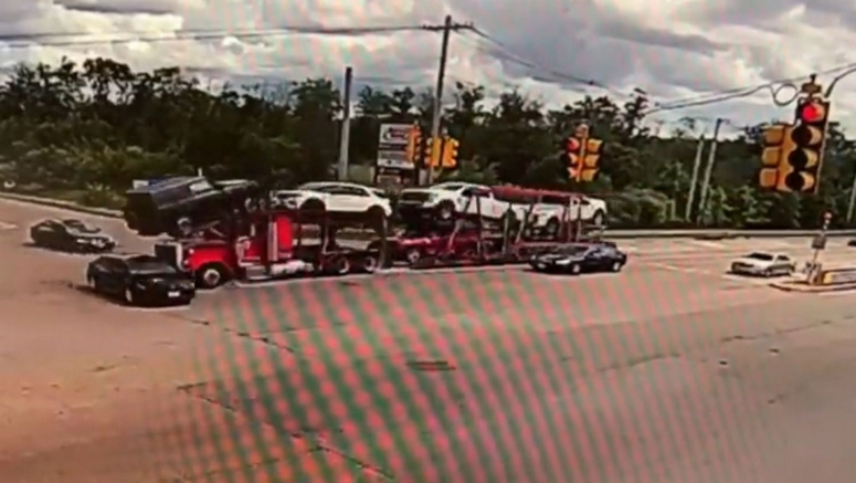 Speeding Car Carrier Runs Red Light, Sends Toyota Corolla Spinning