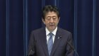 Sources: Abe questioned over funding scandal