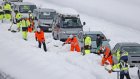 Giant traffic jam strands hundreds after snow storm in Japan